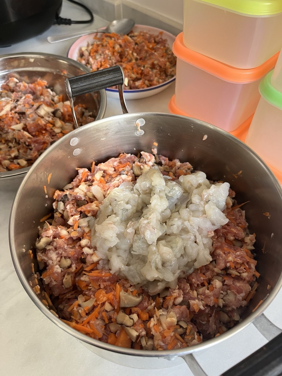 Close-up of the filling: minced pork, chopped prawns, carrots, and mushrooms before mixing.